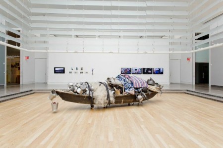 Subodh Gupta, What does the room encompass that is not in the city?. 2014, found boat, found objects, found utensils, fabric, steel, found fishing net, bamboo, rope, plastic pipe. 573 x 152.4 x 122 cm. Photo by Hai Zhang